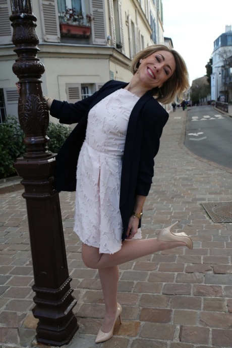 Older French woman wears a bra and tan stocking s while riding on top a dick