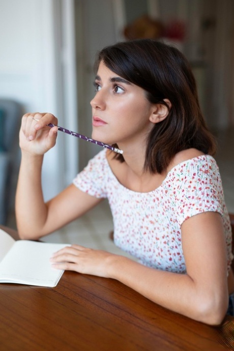 Shy American model Ana Maria gets rid of her clothes and poses nude in chair