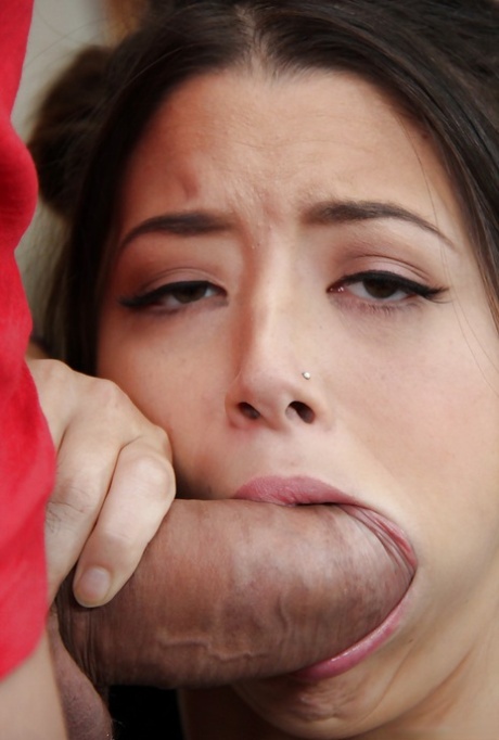 Cute Asian teen Daisy Haze sucking on an unbelievably large dick