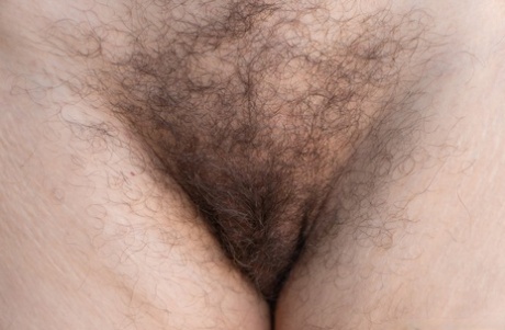 Mature MILF Nimfa Mannay displays her natural pussy beside a dirt road