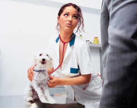 Gorgeous vet Angel Dark sucks dog owner's cock in white stockings & cages him