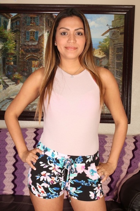 Sassy stripping beauty Nicole Rey flashes her perfect pussy in closeup