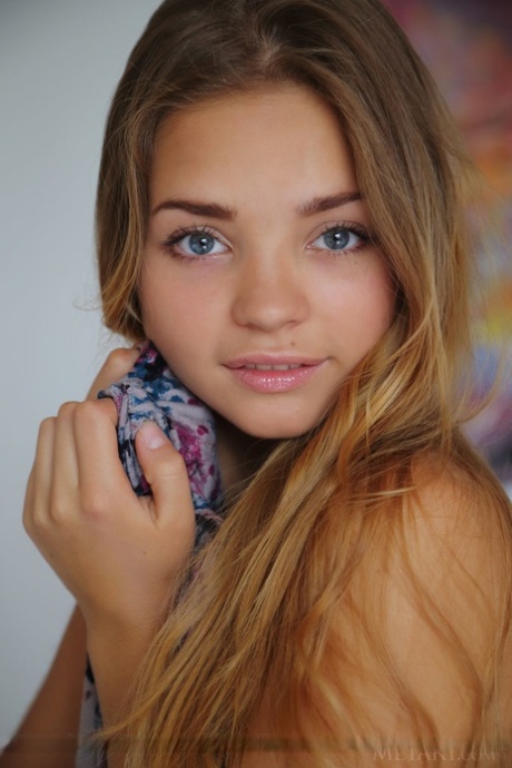 Charming teen girl Colleen A showcases her hairless vagina after getting naked