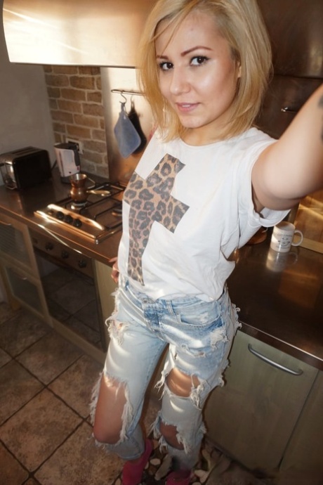 Naughty blonde amateur shows her lovely tits & takes selfies around the house