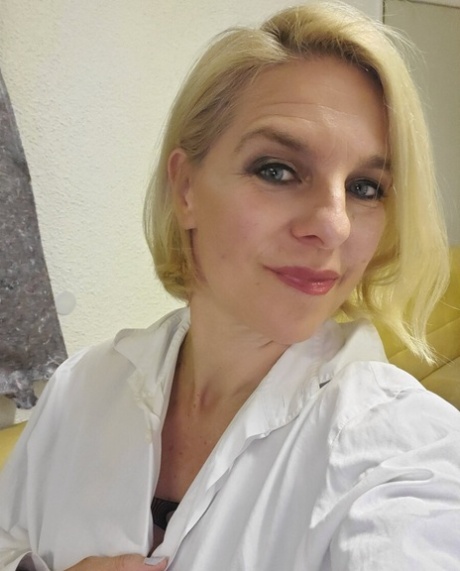 Beautiful mature amateur shows her hot curves while drinking a morning coffee