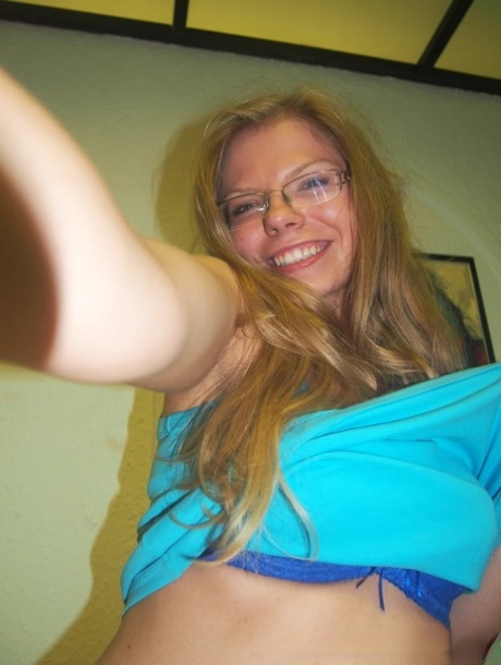 Sexy amateur teacher gets topless and takes selfies of her juicy breasts