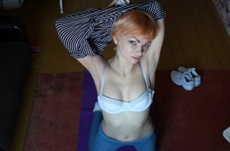 Ginger amateur stripping and fingering herself on her yoga mat in a solo
