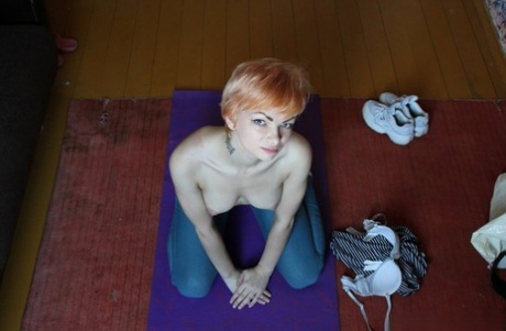 Ginger amateur stripping and fingering herself on her yoga mat in a solo