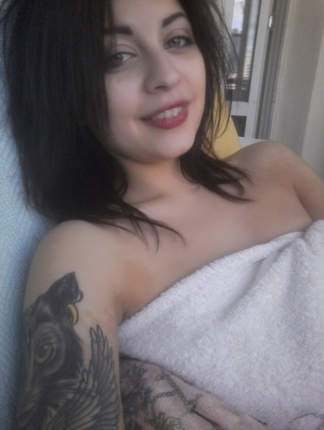 Gorgeous amateur babe takes selfies of her sexy boobs and inked body