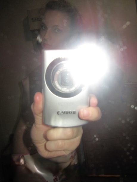 Sensational teen takes hot selfies while posing naked in her living room