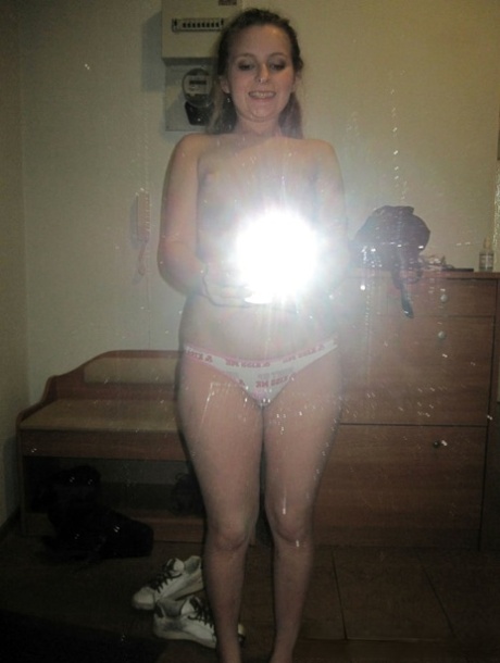 Sensational teen takes hot selfies while posing naked in her living room