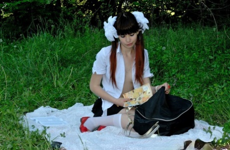 18-year-old schoolgirl peels on a blanket outdoors & shows her big ass & holes