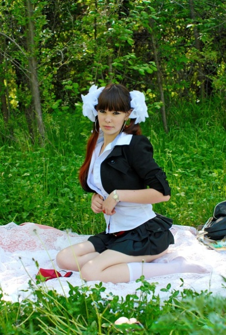 18-year-old schoolgirl peels on a blanket outdoors & shows her big ass & holes