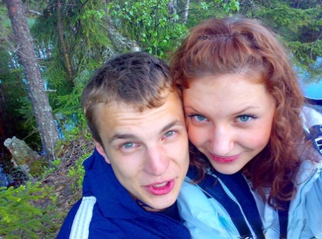 Amateur girl with red hair changes into a bikini before getting in the ocean