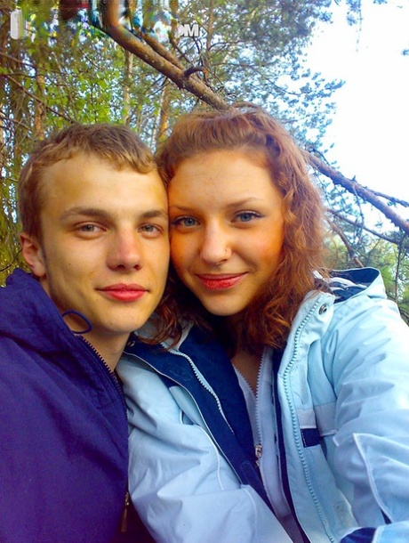 Amateur girl with red hair changes into a bikini before getting in the ocean