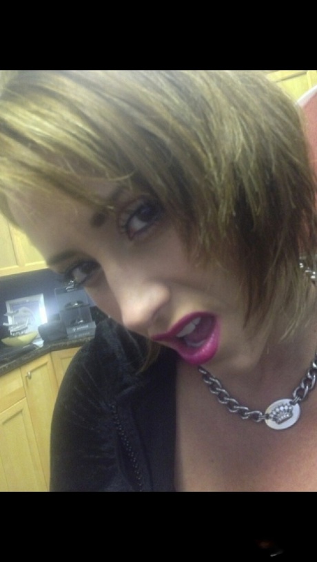 Cougar Eva Notty poses in her Xmas outfit before getting her huge tits jizzed