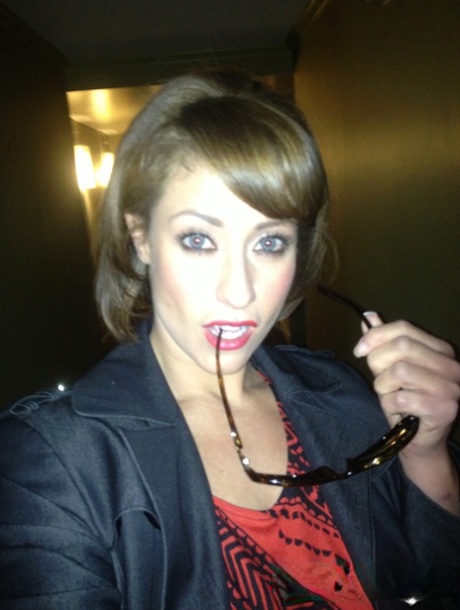 Cougar Eva Notty poses in her Xmas outfit before getting her huge tits jizzed