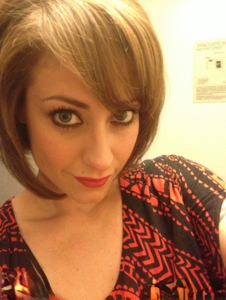 Cougar Eva Notty poses in her Xmas outfit before getting her huge tits jizzed