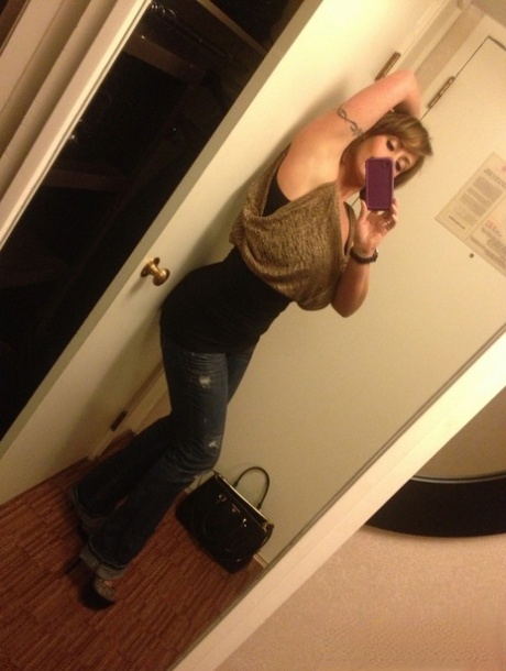 Cougar Eva Notty poses in her Xmas outfit before getting her huge tits jizzed