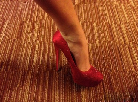 Cougar Eva Notty poses in her Xmas outfit before getting her huge tits jizzed