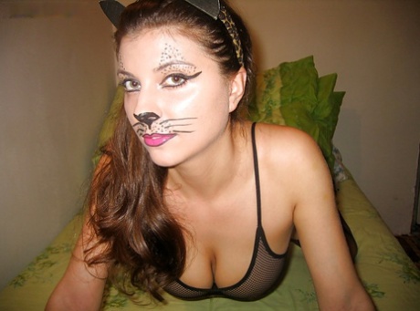 Playful kitty with big tits posing in lingerie and stockings