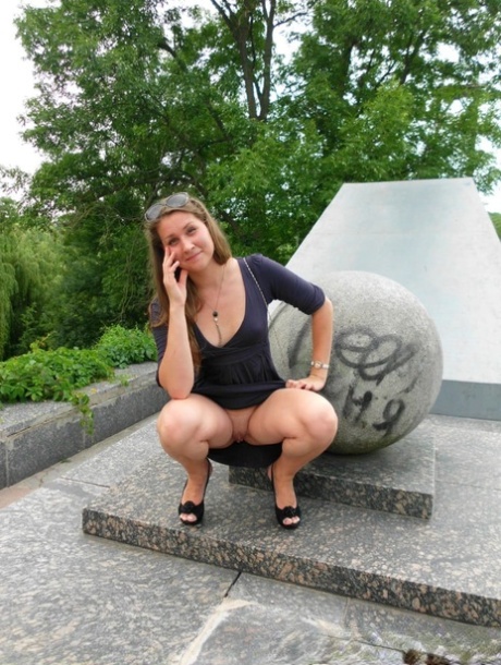 Naughty amteur gives a pantyless upskirt in public and while pissing