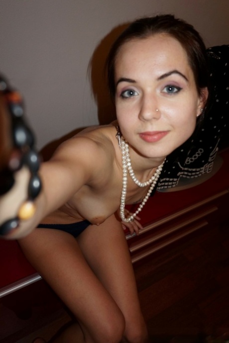 Cute brunette nerdy teen reveals her small tits and shaved cunt at home