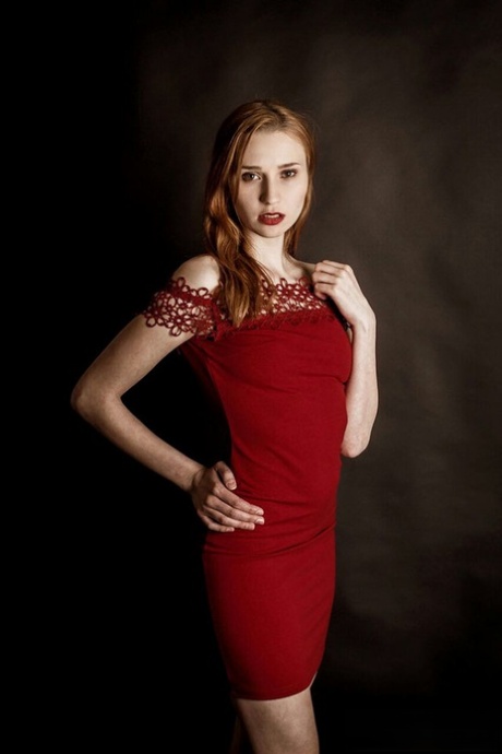 Young redhead Radka takes clothed and topless selfies around her place