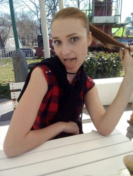 Young redhead Radka takes clothed and topless selfies around her place