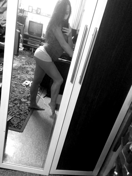 Naughty amateur teen poses in the mirror for selfies in hot outfits & lingerie
