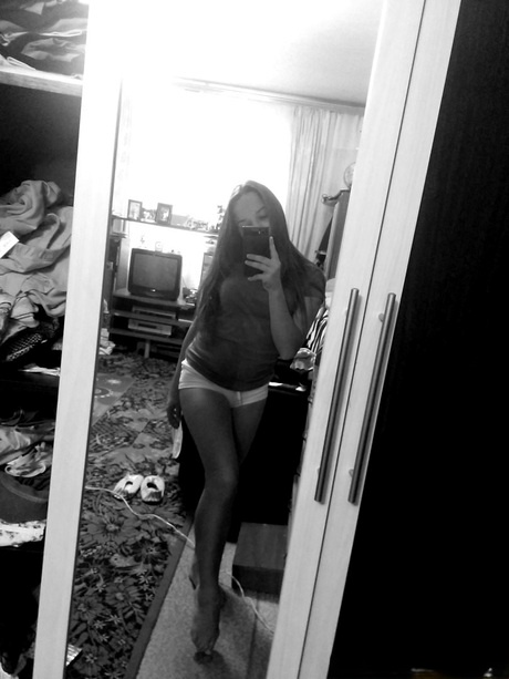 Naughty amateur teen poses in the mirror for selfies in hot outfits & lingerie