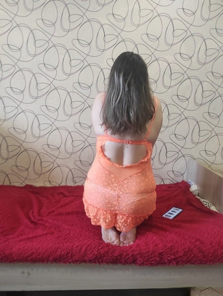 Horny chubby babe unveils her big tits and big ass on a red bed