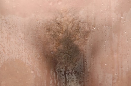 Babe with small boobs and amazing ass Cecelia flaunts her bush in the shower