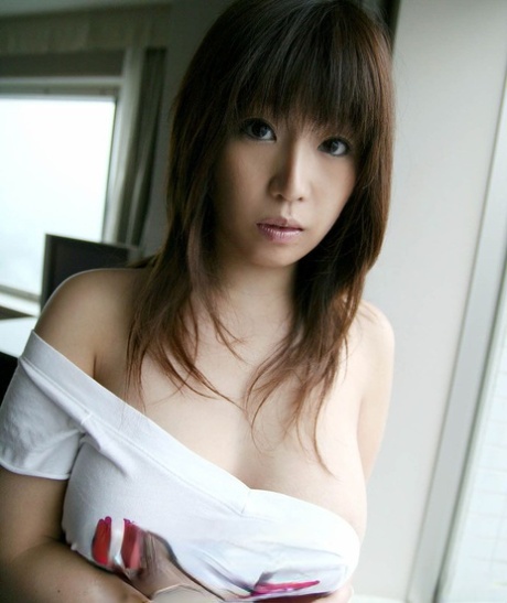 Busty Japanese girl Hirono frees her bush from panties and pleated skirt