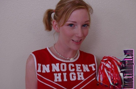 Pigtailed cheerleader Alexa Lynn flashes tiny natural tits and panties