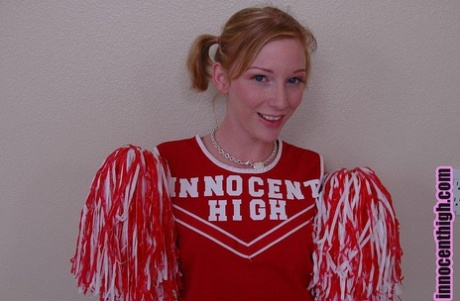 Pigtailed cheerleader Alexa Lynn flashes tiny natural tits and panties