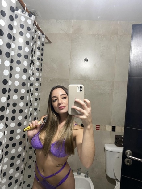 Amateur solo girl Sara Core takes selfies in lingerie and bikinis