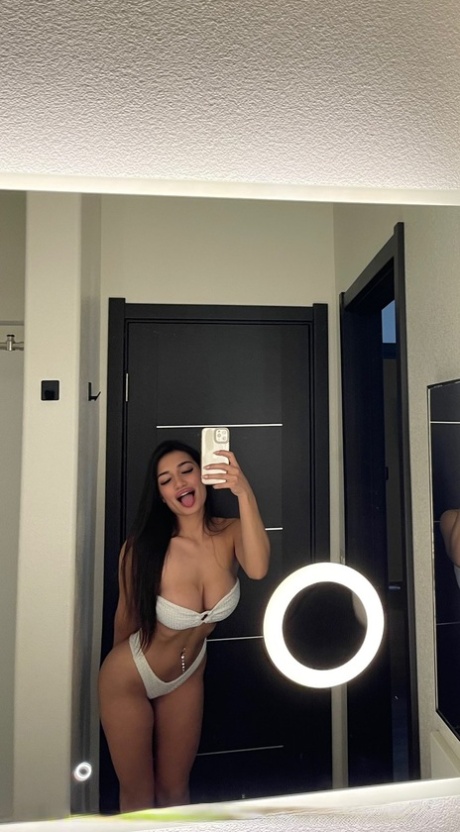 Brunette babe Maddie Gech teases with her amazing ass and shows her breasts