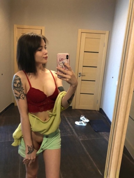 Sweet inked teen Morena Marianotarta strips naked and poses in the mirror