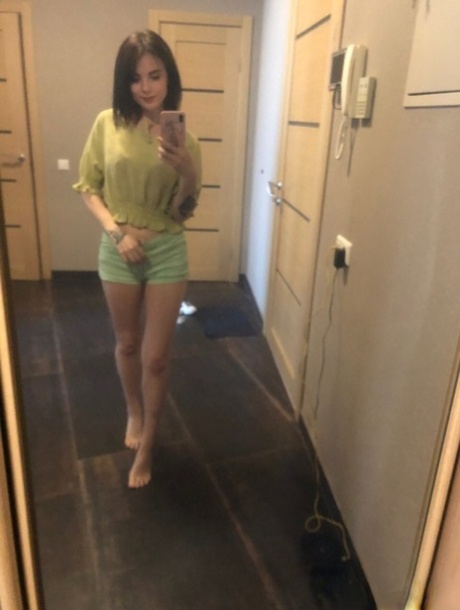 Sweet inked teen Morena Marianotarta strips naked and poses in the mirror