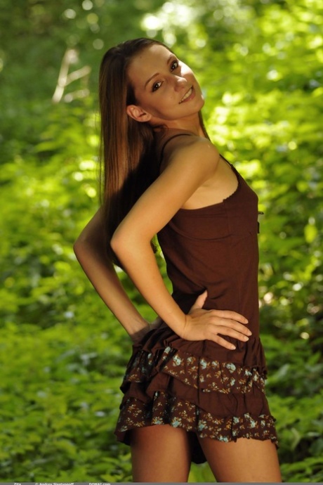 Hot babe Zita getting rid of her clothes and posing naked in the forest