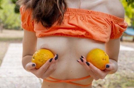 Young looking girl Shea picks ripe fruit before getting butt naked