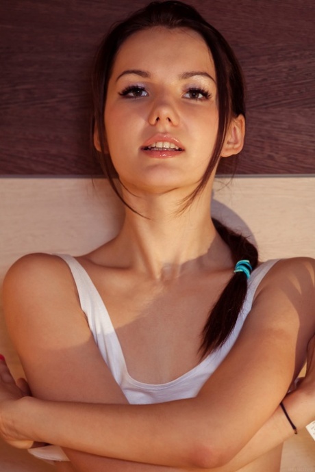 Adorable teen Iva strips and spreads her beaver while eating a fruit salad