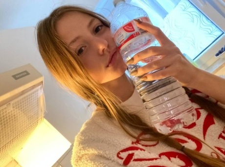 Cute young girl Katya Sun poses her numerous non-nude self shots