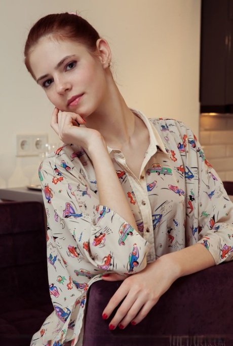 Young redhead Juliett Lea shows her pink twat after stripping to socks