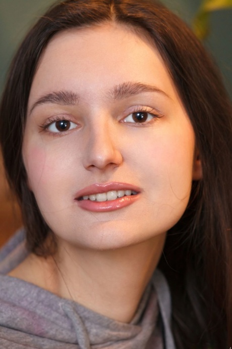 Brunette beauty Adeline massages her big boobs and spreads her hairy pussy