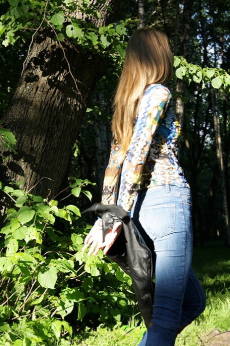 Slim amateur uncovers her small tits in blue jeans during homemade action