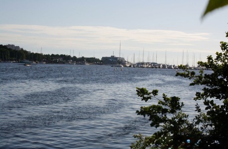 Slim amateur uncovers her small tits in blue jeans during homemade action