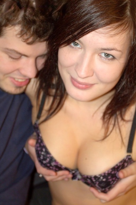 Brunette amateur holds her boobs while sucking cock after fucking