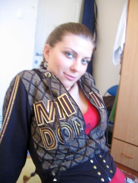 Busty amateur Lory finger spreads her pussy after getting naked on her bed